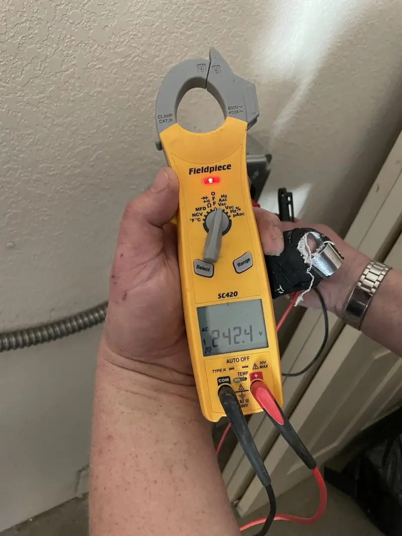 Voltage testing with clamp meter during Recessed Lighting Installation in Fairmount